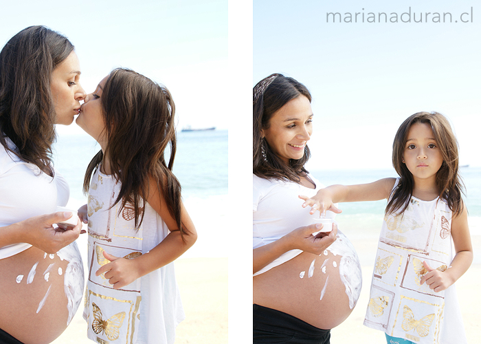 Mamá e hija pintando la panza